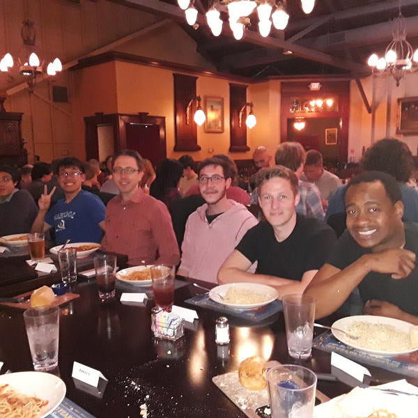 Four male GSMP participants at dinner